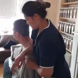 Holistic physiotherapy session using Traditional Chinese Medicine methods to support recovery and mobility.